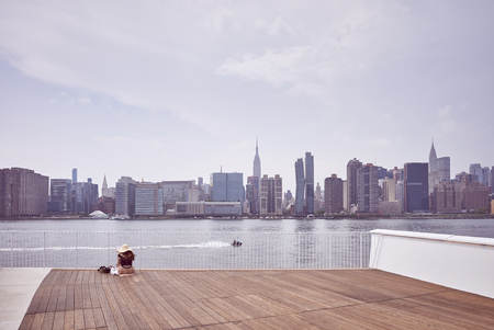 New York City skyline seen from observation deck, color toning applied, USA.の写真素材