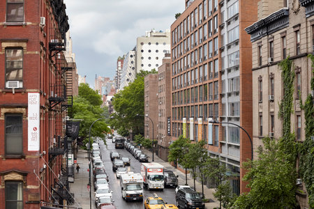 New York, USA - June 28, 2018: Traffic on West 17th Street seen from the High Line on a rainy day.