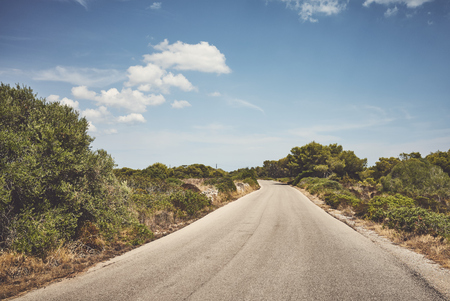 Countryside asphalt road on Mallorca, color toning applied, Spain.の写真素材