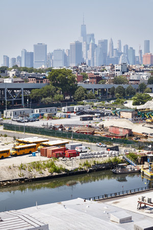 New York, USA - July 02, 2018: Manhattan seen from Brooklyn industrial neighborhood on a hazy summer day.のeditorial素材