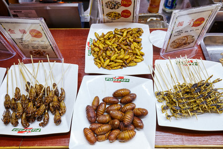 Guilin, China - September 15, 2017: Edible insects on a night market restaurant display.のeditorial素材