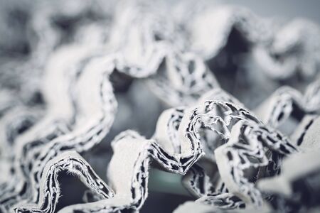 Abstract background made of shredded cardboard, selective focus, color toning applied.の写真素材