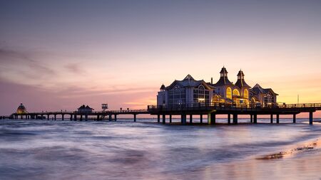 Pier in Sellin, the Jewel of Rugia (Ruegen) Baltic Coast island at purple sunrise, Germany.の写真素材