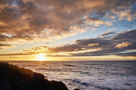 Scenic sunset over the ocean, Puerto de la Cruz, Tenerife, Spain.