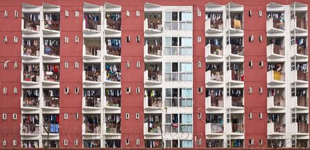 Residential apartment building with drying laundry on balconies, Chengdu, China.の写真素材