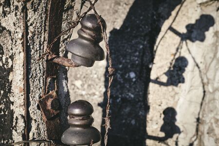 Close up picture of old rusty barbed wire, selective focus, color toning applied.の写真素材