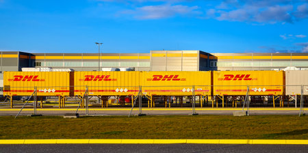Kolbaskowo, Poland - March 05, 2020: DHL containers in front of Amazon Robotics e-commerce center in Kolbaskowo at sunset.のeditorial素材