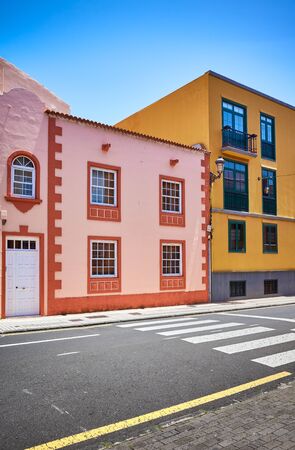 Colorful houses by a street in La Laguna old town, Tenerife, Spain.の写真素材