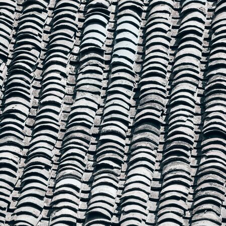 Old clay tile roof, abstract background.の写真素材