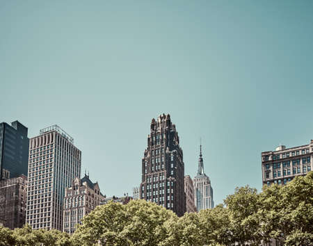 New York City skyline on a sunny cloudless day, vintage color toning applied, USA.