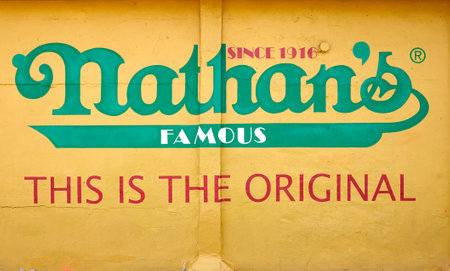 New York, USA - July 02, 2018: The Nathan's Famous sign painted on wall of restaurant specializing in hot dogs on Coney Island.のeditorial素材