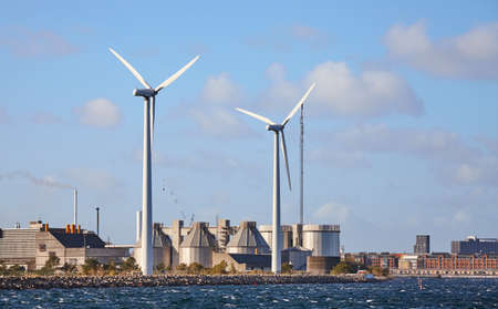 Industrial coast on a beautiful sunny day seen from the sea.