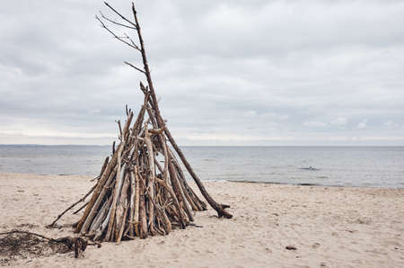 Temporary wood shelter on an empty beach.の写真素材