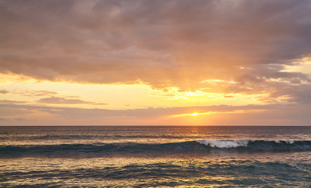 Picture of a seascape at beautiful golden sunset.の写真素材