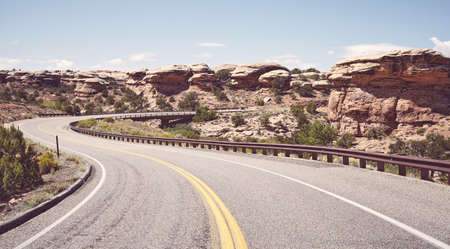 Retro toned picture of road bend in Canyonlands National Park, Utah, USA.の写真素材