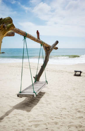 Wooden swing on a tropical beach in Sri Lanka.の写真素材