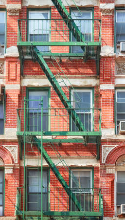 Old building with green fire escape, New York City, USA.の写真素材