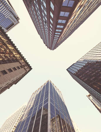 Looking up at Manhattan skyscrapers, color toned picture, New York City, USA.の写真素材