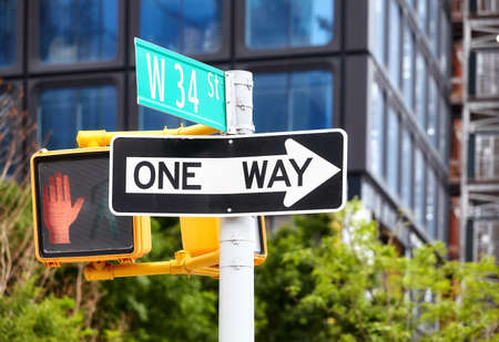 One way traffic sign on the West 34 Street in New York City, selective focus, USA.の写真素材