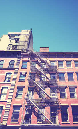 Color toned picture of building with fire escape, New York City, USA.の写真素材