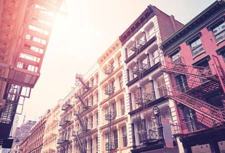 New York cityscape with old buildings with fire escapes, color toning applied, USA.の写真素材