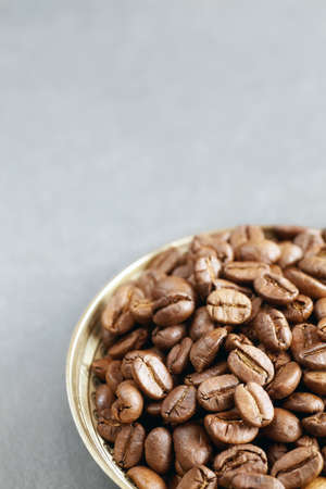 Roasted coffee beans in a bowl, selective focus, space for text.の写真素材