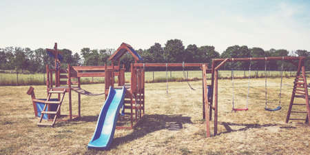 Playground on grass, retro color toning applied.