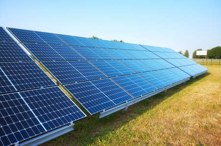 Picture of solar panel modules on a sunny day, selective focus.