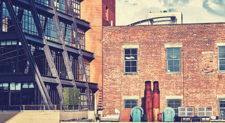 Urban scene with rusty exhaust pipes, color toning applied, New York City, USA.