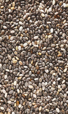 Extreme close up picture of chia seeds, selective focus, natural food background.の写真素材