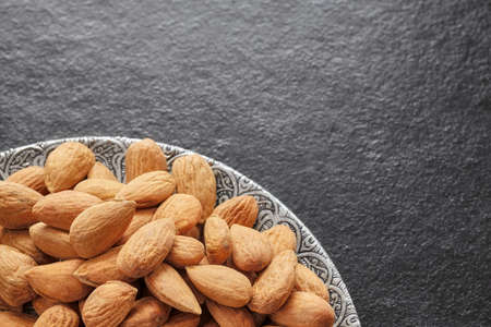 Close up of almonds on a plate, selective focus.の写真素材