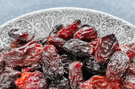 Close up picture of sweet raisins in a bowl, selective focus.の写真素材