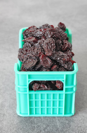 Close up photo of raisins in miniature container, selective focus.の写真素材