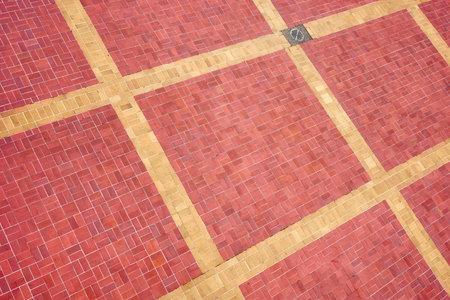 Photo of a brick pavement background.