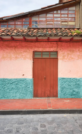 Street view of an old colonial building facade, Cuenca, Ecuador.の写真素材