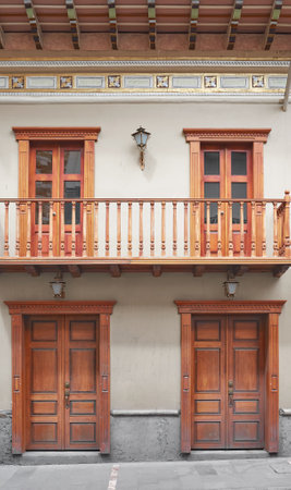 Street view of the old facade of a colonial building, Cuenca, Ecuador.の写真素材