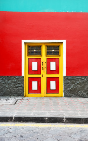 Street view of the facade of an old colonial building, Cuenca, Ecuador.の写真素材