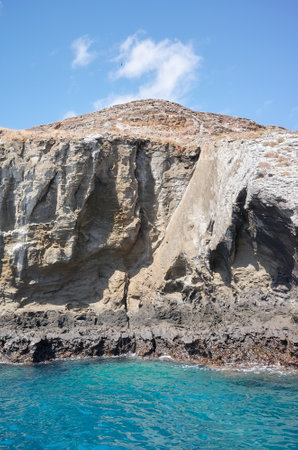 Rocky cliff seen from the water, Galapagos Islands, Ecuador.の写真素材