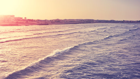 Seascape seen from above the water at sunset, retro color toning applied, Egypt.の写真素材