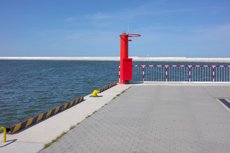 Entrance to the port with a walkway by the water, nautical background.の写真素材