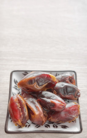 Close up photo of dried dates, selective focus.