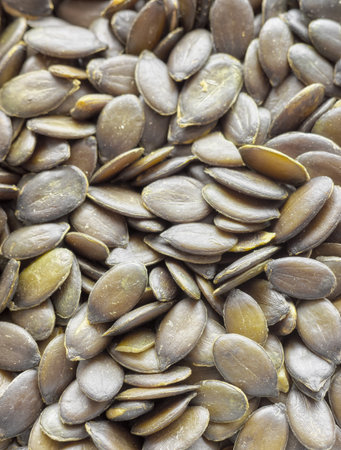 Close up photo of peeled pumpkin seeds, selective focus.の写真素材
