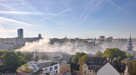 Smoke from the chimneys of houses.の写真素材