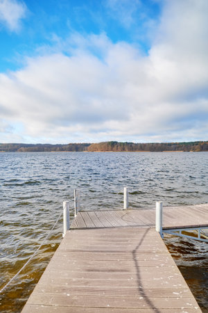 Pier on Lake Charzykowskie in autumn, Charzykowy, Poland.の写真素材