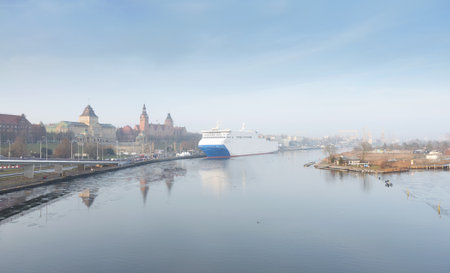 Panorama of Szczecin waterfront with a ferry moored at the Odra River quay, Poland.の写真素材
