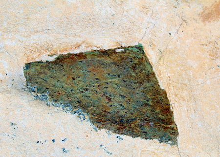 Triangular stone in a wallの写真素材