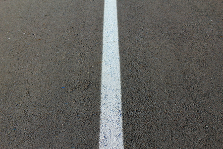 White line on black asphaltの写真素材