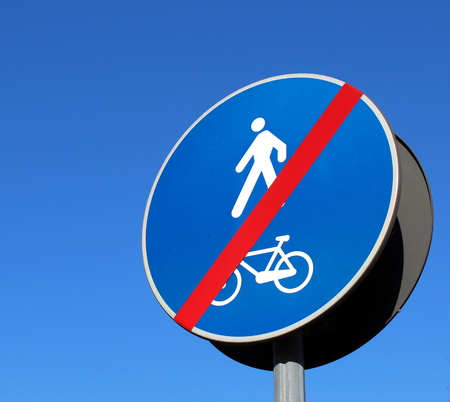 Bike lane end road signの写真素材