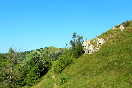 Hiking trail in the mountainsの写真素材