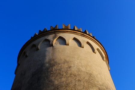 Round tower with battlements and archesの写真素材
